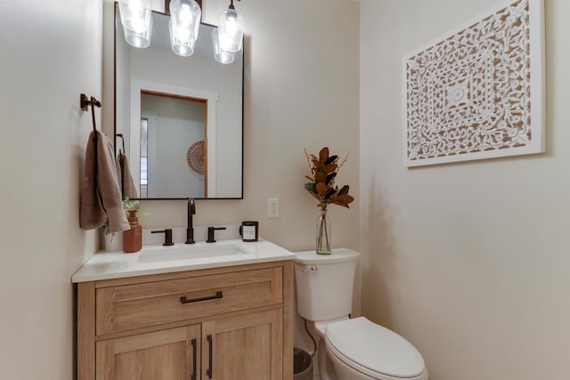 bathroom with toilet and vanity