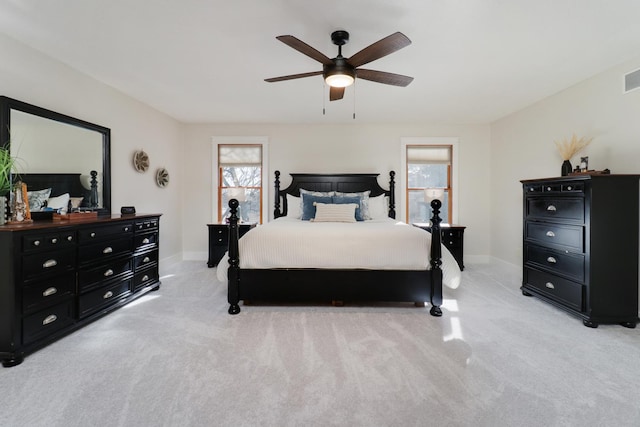 bedroom with light carpet and ceiling fan