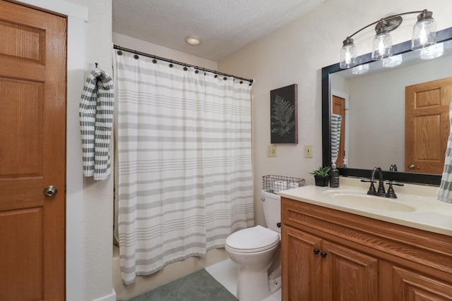 full bathroom featuring shower / bath combo, a textured ceiling, toilet, and vanity