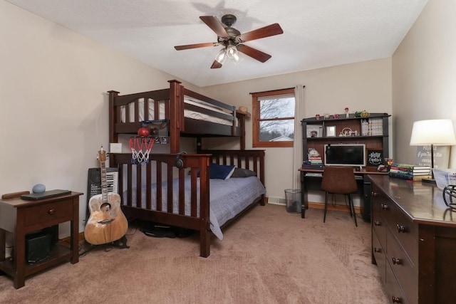 bedroom with ceiling fan and light colored carpet