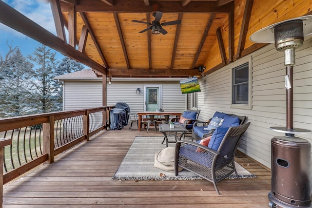 wooden deck featuring ceiling fan, an outdoor living space, and grilling area