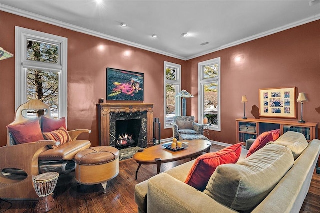 living room with ornamental molding, a high end fireplace, and dark hardwood / wood-style floors