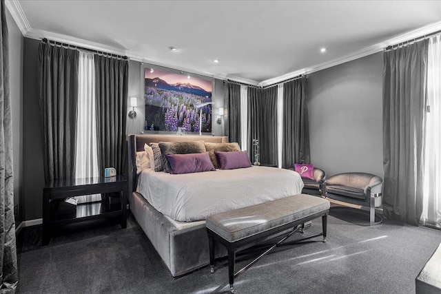 bedroom featuring ornamental molding and carpet floors