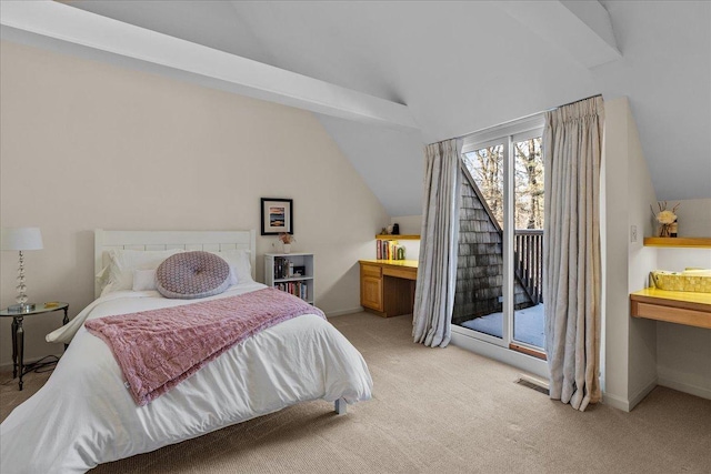 carpeted bedroom with lofted ceiling and access to outside