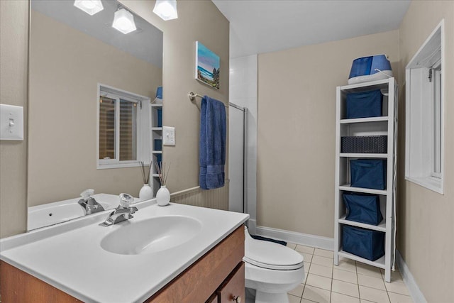 bathroom featuring vanity, an enclosed shower, tile patterned floors, and toilet