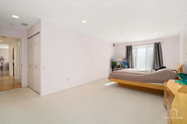 carpeted bedroom with a closet