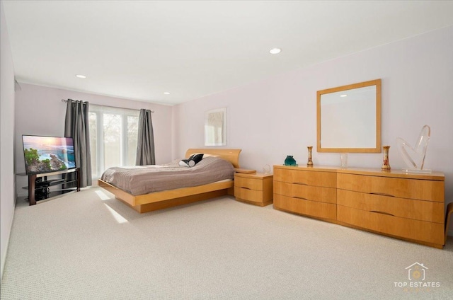 bedroom with light colored carpet