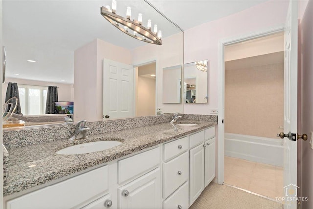 bathroom featuring tile patterned floors and vanity