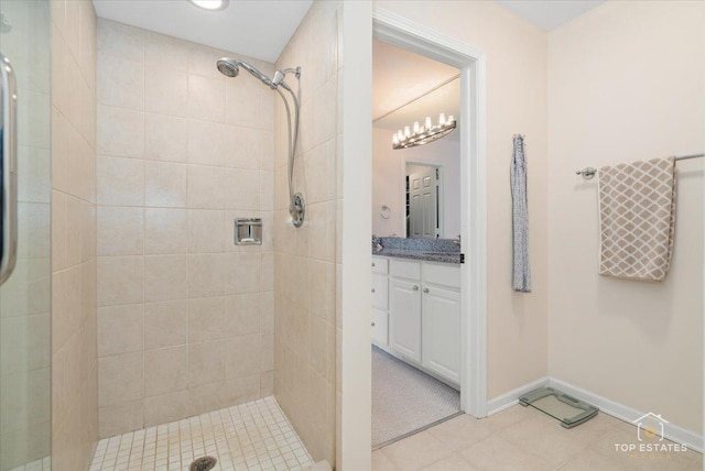 bathroom featuring vanity and a tile shower