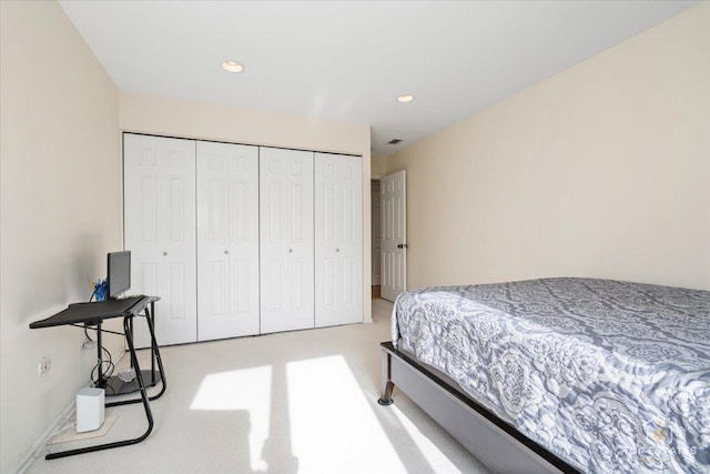 carpeted bedroom with a closet