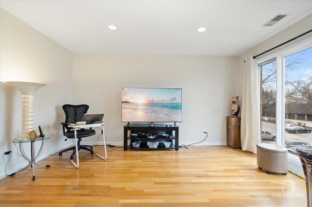 sitting room featuring light hardwood / wood-style flooring