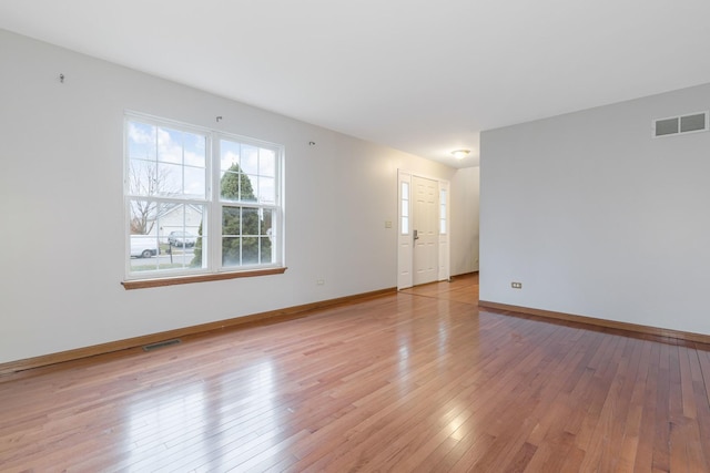 unfurnished room featuring light hardwood / wood-style flooring