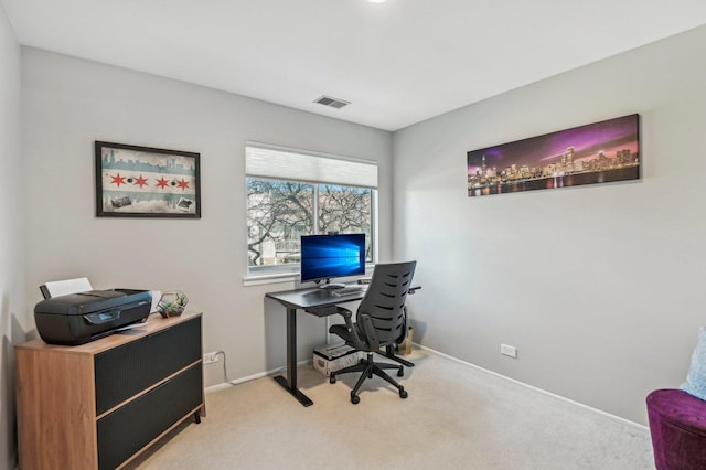 office area featuring light carpet