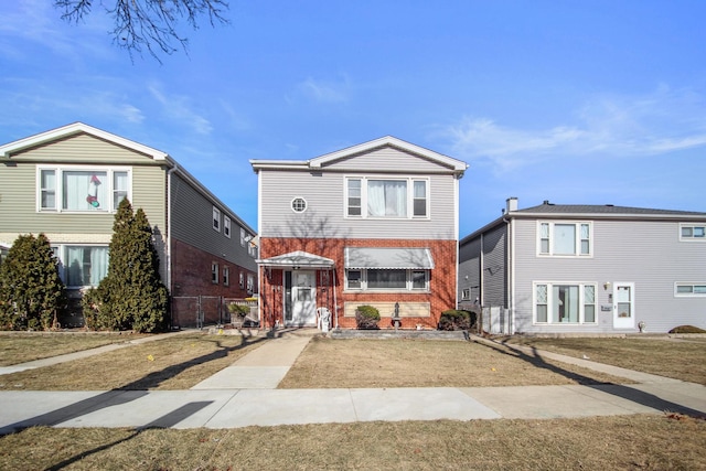 front facade with a front yard