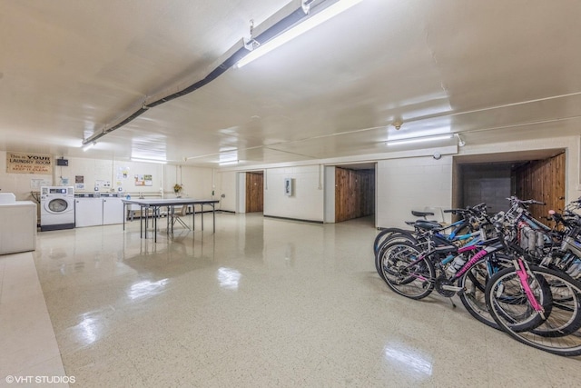 garage with washing machine and dryer