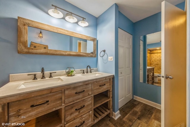 bathroom featuring hardwood / wood-style flooring and vanity