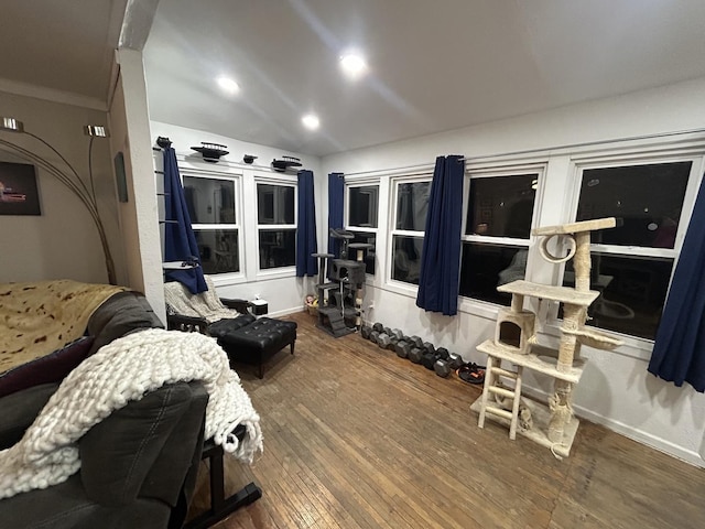 bedroom with wood-type flooring and ornamental molding