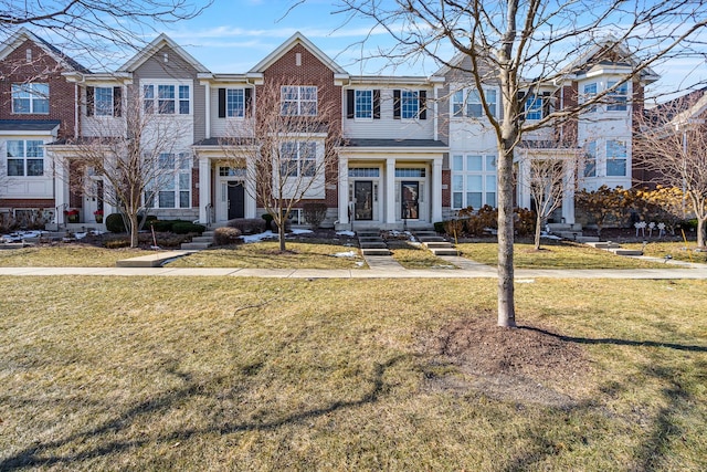 view of property featuring a front lawn