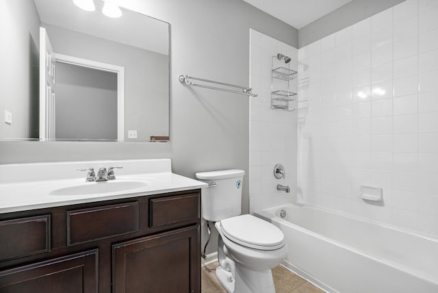 full bathroom with vanity, tile patterned flooring, tiled shower / bath combo, and toilet