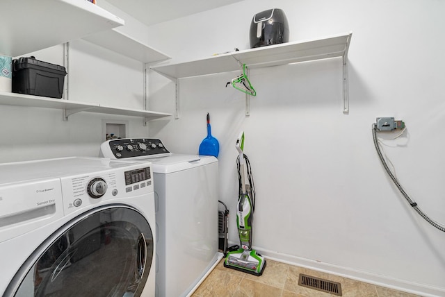 laundry room featuring independent washer and dryer