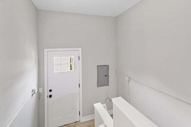 foyer entrance featuring light hardwood / wood-style flooring and electric panel