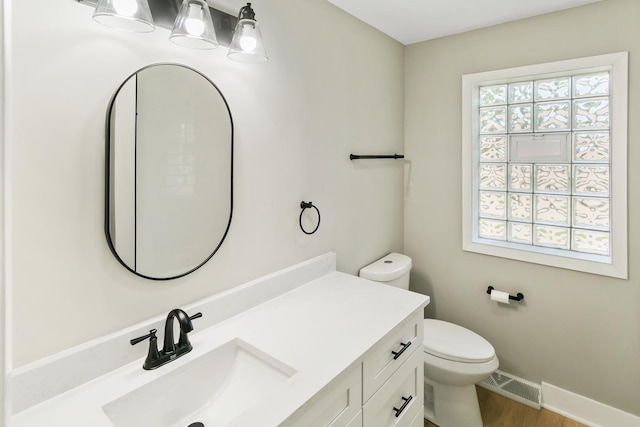 bathroom with vanity and toilet