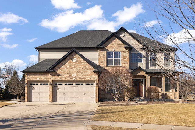 view of front of property featuring a garage and a front yard