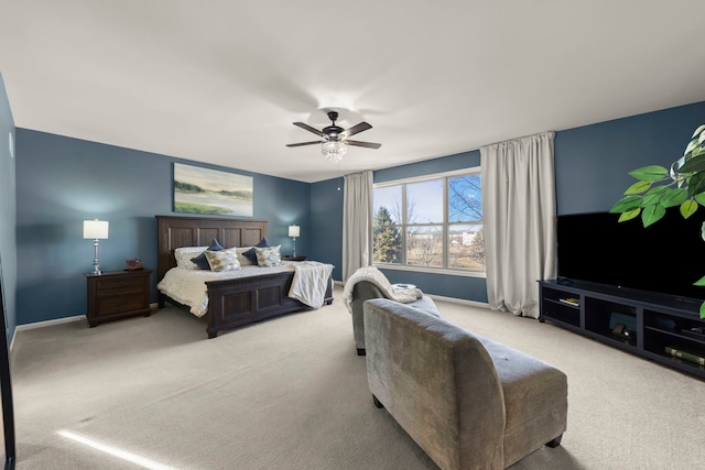 bedroom featuring light colored carpet and ceiling fan