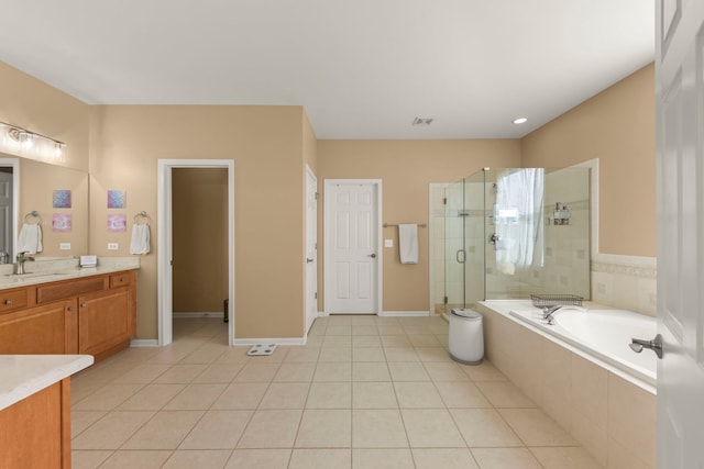 bathroom with tile patterned floors, vanity, and independent shower and bath