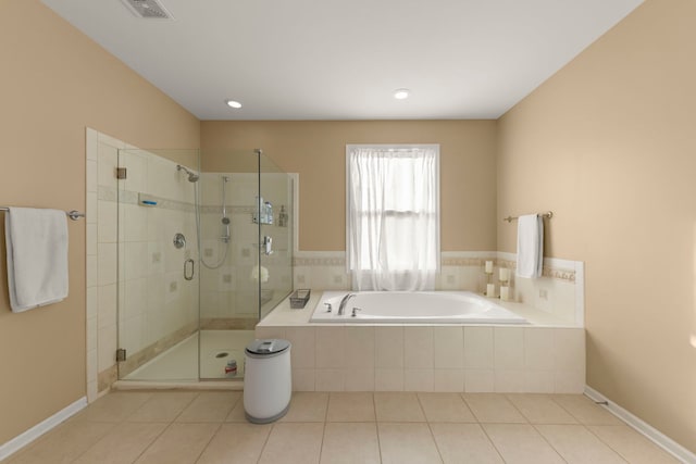 bathroom with plus walk in shower and tile patterned floors