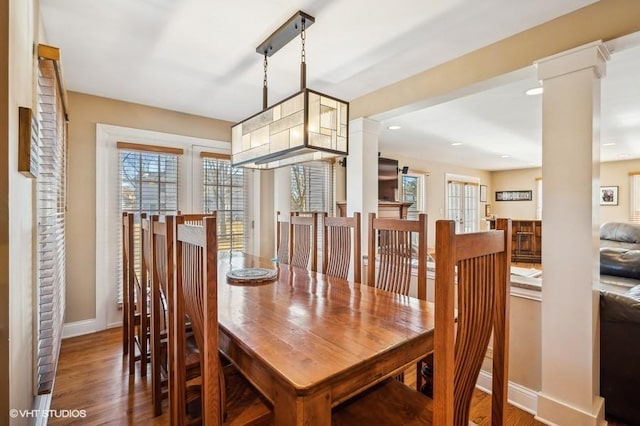 276 Stanton Dr, Buffalo Grove, IL 60089 - dining room with decorative columns, plenty of natural light, wood finished floors, and recessed lighting