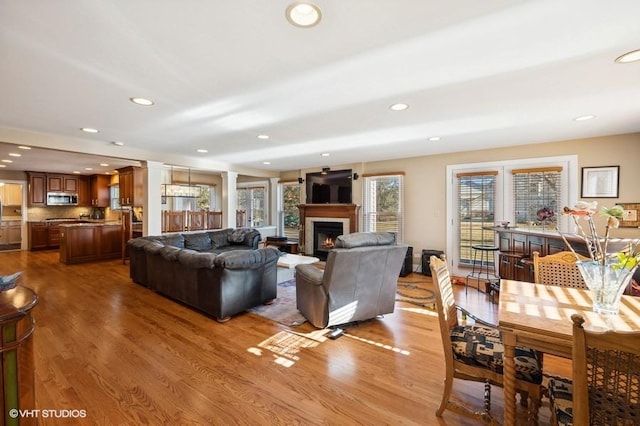 276 Stanton Dr, Buffalo Grove, IL 60089 - living area with wood finished floors, a glass covered fireplace, and recessed lighting