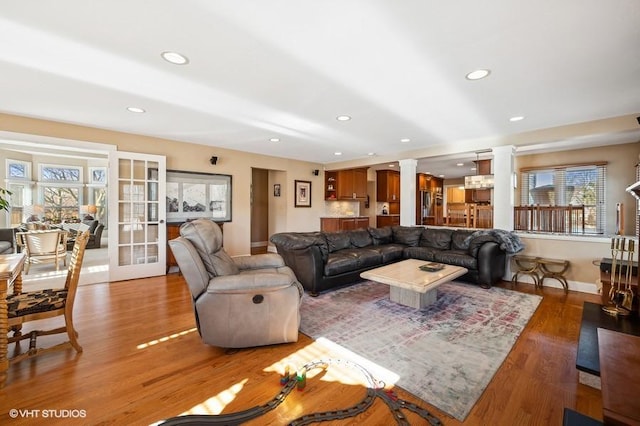 276 Stanton Dr, Buffalo Grove, IL 60089 - living area featuring ornate columns, wood finished floors, recessed lighting, and french doors