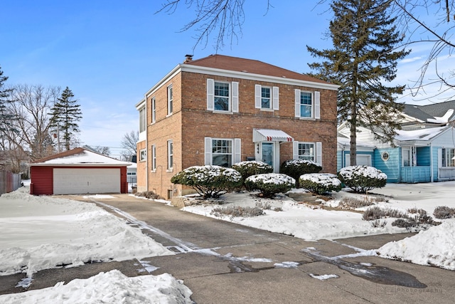 view of front of home with a garage and an outdoor structure