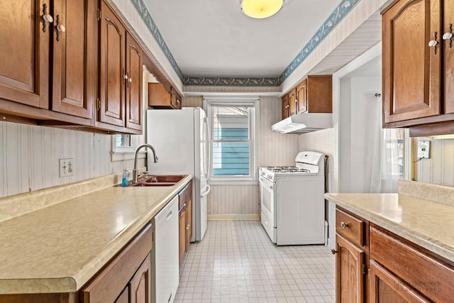 kitchen with sink and white appliances