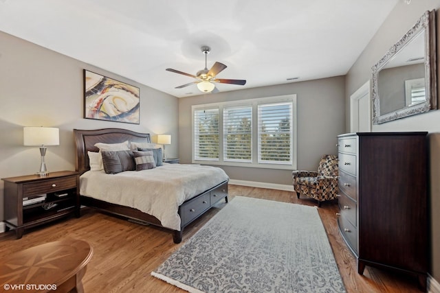 bedroom featuring hardwood / wood-style floors and ceiling fan