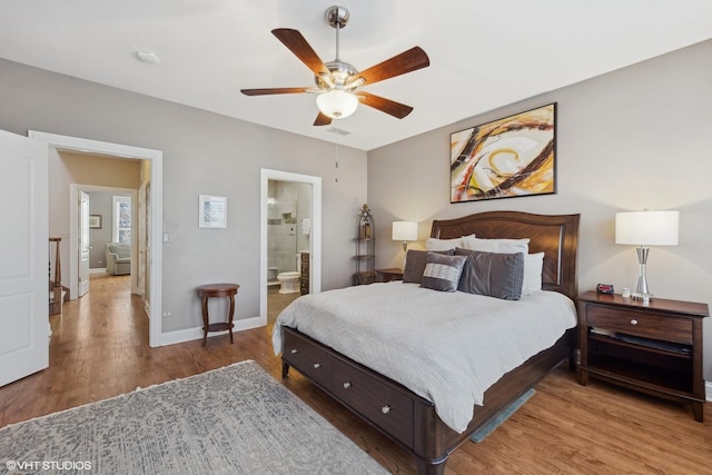 bedroom featuring ceiling fan, ensuite bathroom, and hardwood / wood-style floors