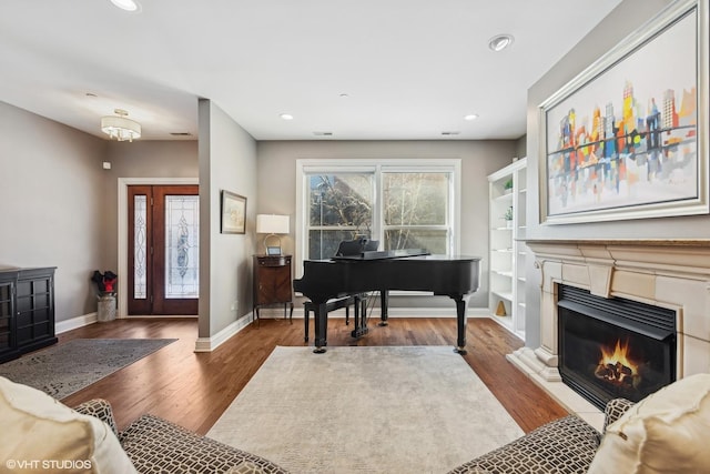 interior space with dark wood-type flooring and built in shelves