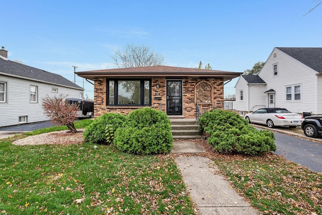 bungalow with a front yard