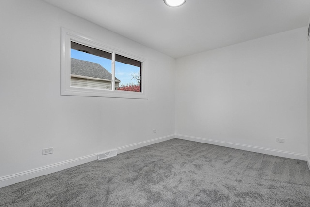 unfurnished room featuring carpet