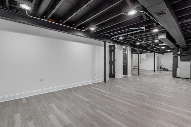 basement featuring light wood-type flooring