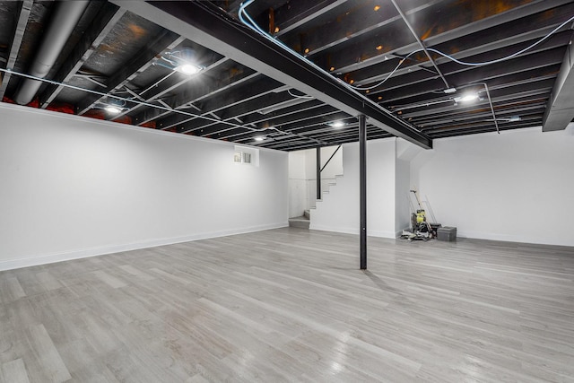 basement with wood-type flooring