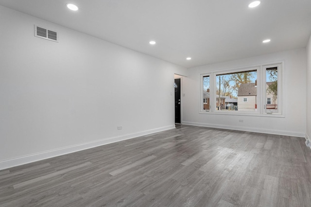 empty room featuring hardwood / wood-style flooring