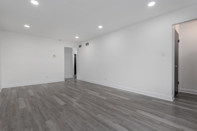 empty room with dark hardwood / wood-style floors