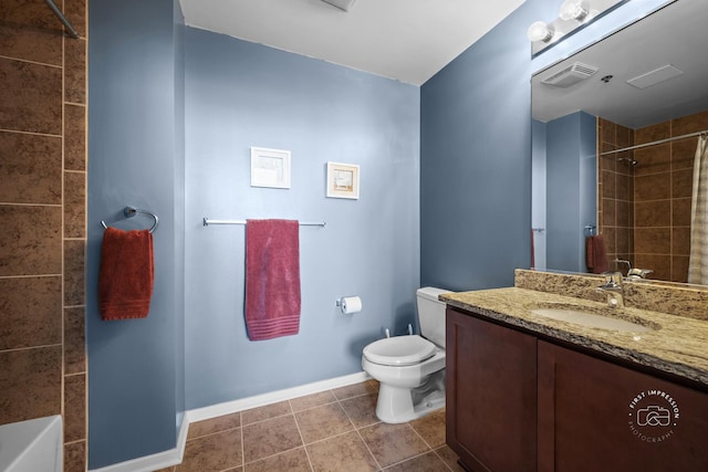 bathroom featuring tile patterned floors, toilet, and vanity