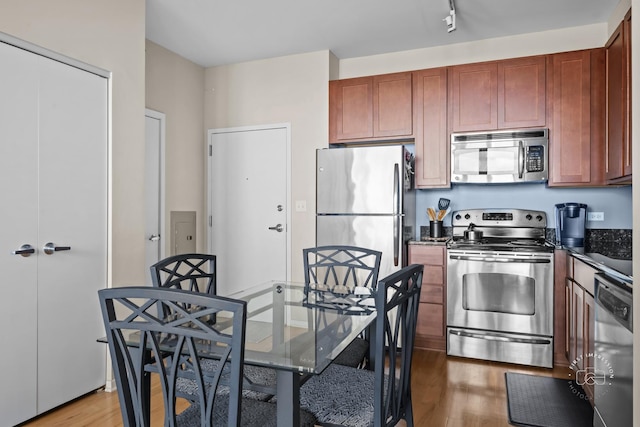 kitchen featuring hardwood / wood-style floors and stainless steel appliances
