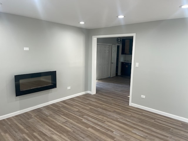 unfurnished living room with wood-type flooring