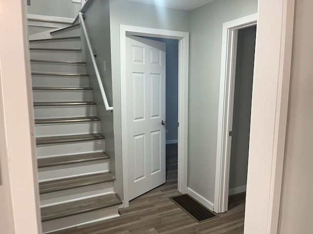 staircase featuring hardwood / wood-style flooring