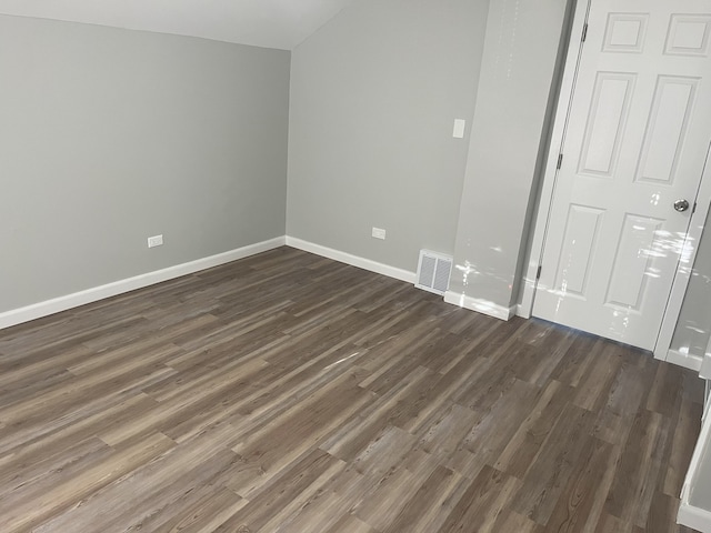 unfurnished bedroom featuring dark wood-type flooring