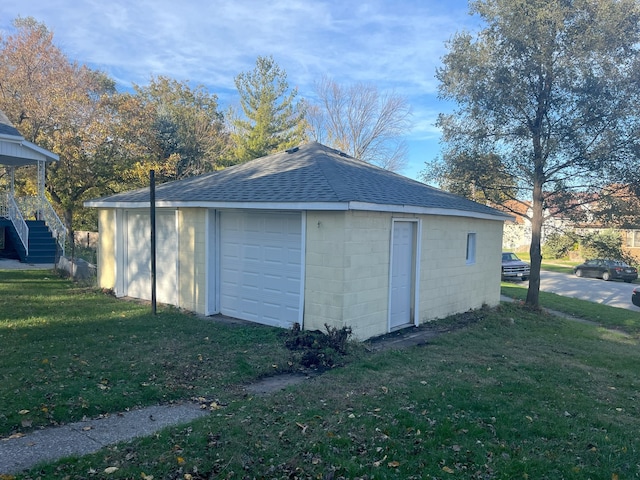 garage with a lawn